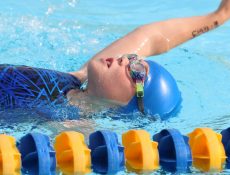 Girl swimming using the backstroke