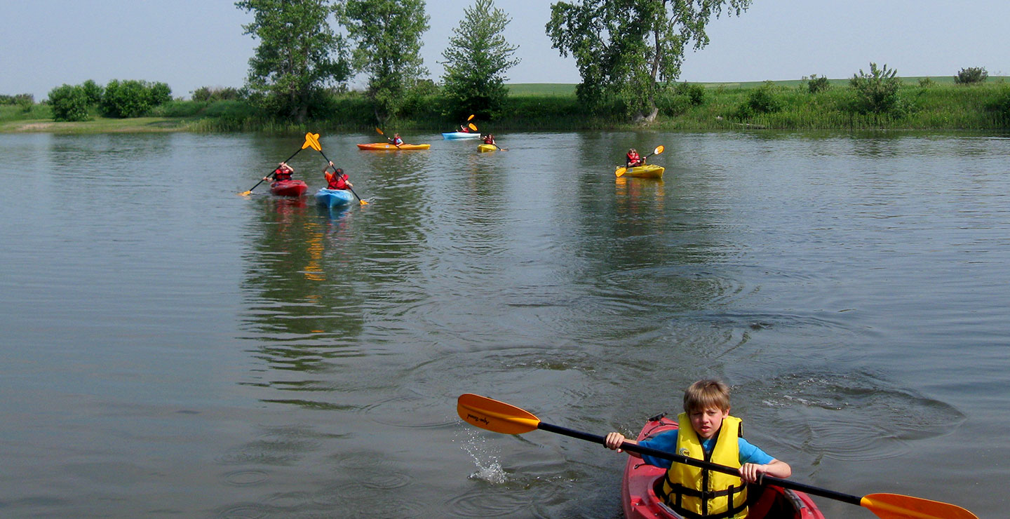 People kayaking on a lake