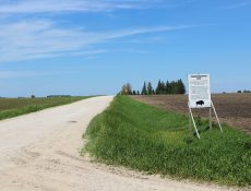 Commemorative Site sign and gravel road