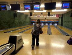 Woman bowling at Laurens Lounge & Lanes