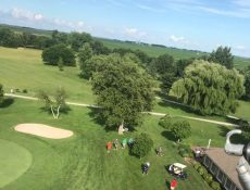 Aerial view of people golfing at Pocahontas Golf Club