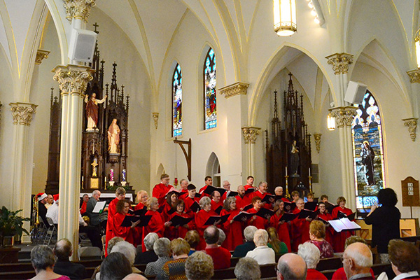 People watching a chorus performance in a church